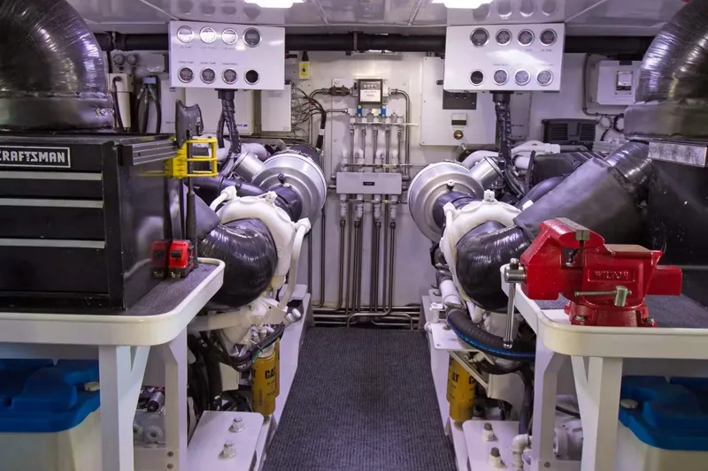 Slide: The Image of Engine room of 2006 Broward Raised Pilothouse yacht with machinery and tools. - 14