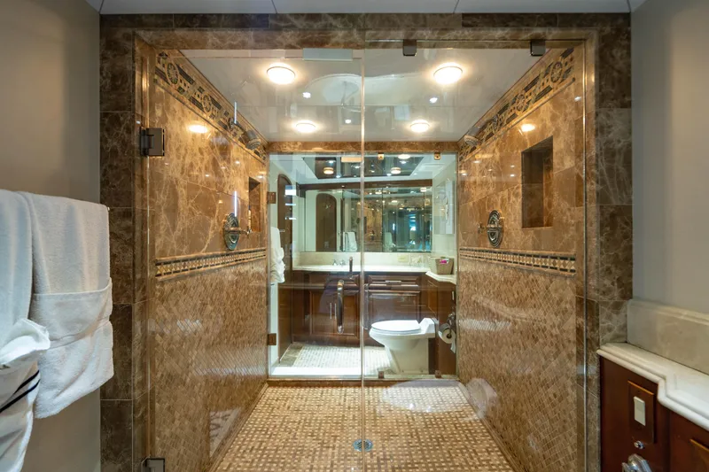 Slide: The Image of Luxurious bathroom with marble tiles in a 2006 Broward Raised Pilothouse yacht. - 17