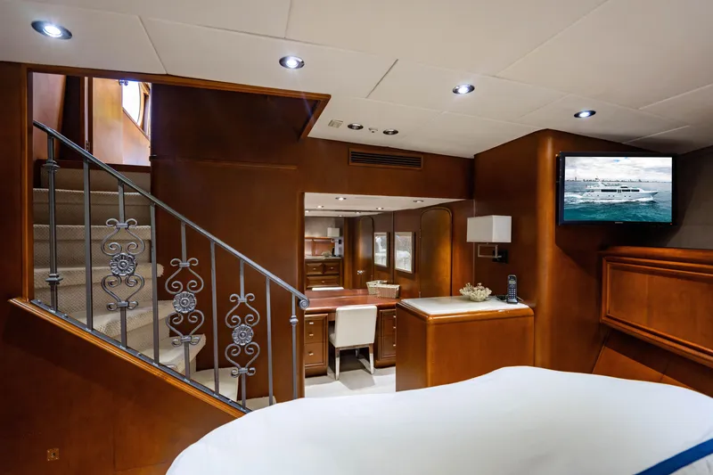 Slide: The Image of Luxurious interior of 2006 Broward Raised Pilothouse yacht with elegant wood finishes and modern amenities. - 19