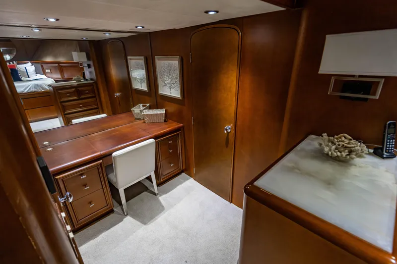 Slide: The Image of Luxurious interior of 2006 Broward Raised Pilothouse yacht with elegant wood furnishings. - 20