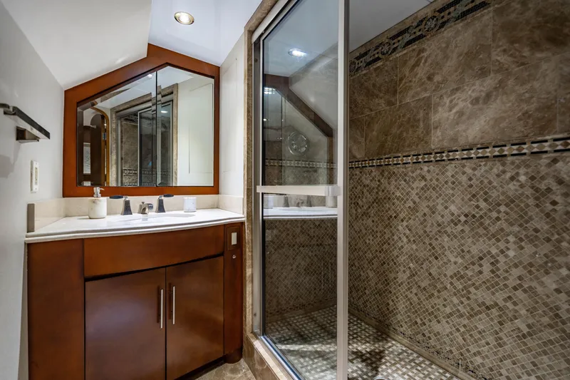 Slide: The Image of Luxurious bathroom in 2006 Broward Raised Pilothouse yacht with elegant tile and modern fixtures. - 21