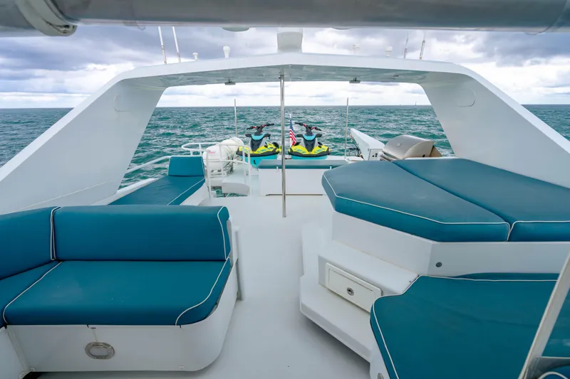 Slide: The Image of Luxurious 2006 Broward Raised Pilothouse yacht deck with seating and ocean view. - 30