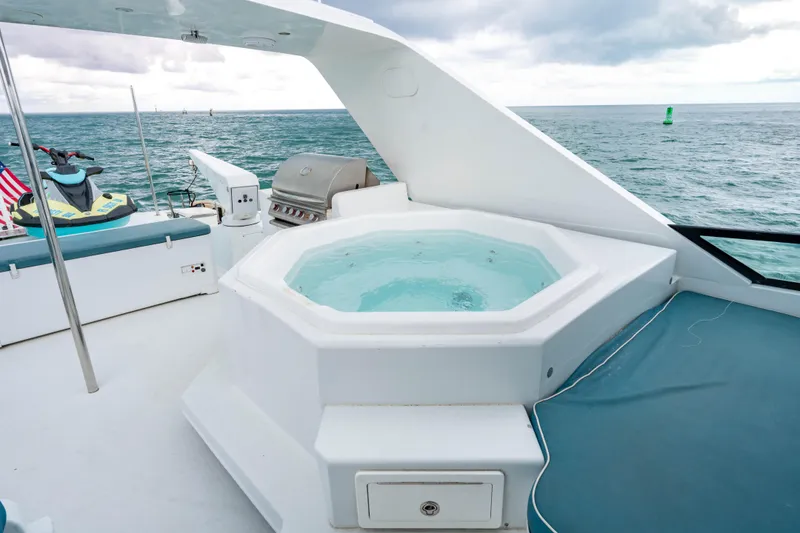 Slide: The Image of Luxury yacht deck with hot tub, grill, and jet ski, Broward Raised Pilothouse 2006. - 31