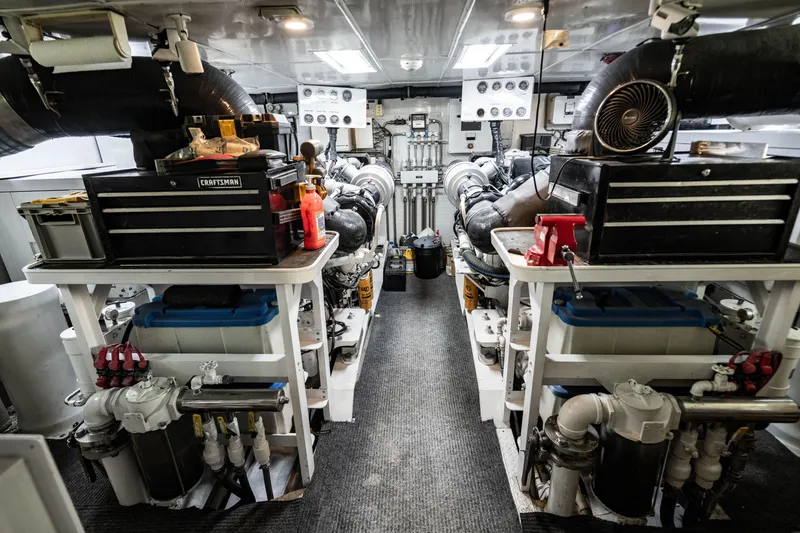 Slide: The Image of Engine room of a 2006 Broward Raised Pilothouse yacht with tools and machinery. - 39