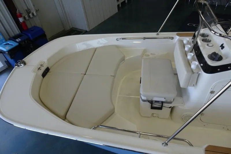 Slide: The Image of 2026 Boston Whaler 170 Montauk boat interior with seating and console. - 14