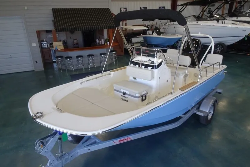 Slide: The Image of 2026 Boston Whaler 170 Montauk boat in showroom, featuring sleek design and modern amenities. - 15