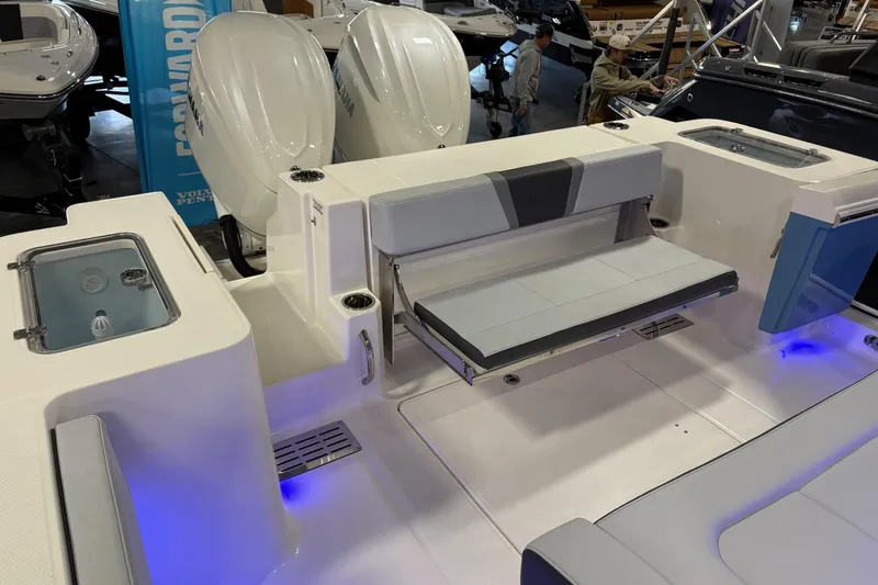 Slide: The Image of 2026 Robalo R300 Center Console boat interior with seating and dual outboard engines. - 12