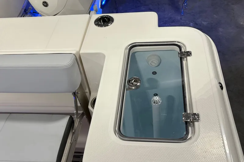 Slide: The Image of 2026 Robalo R300 Center Console boat with sleek seating and storage compartment. - 15