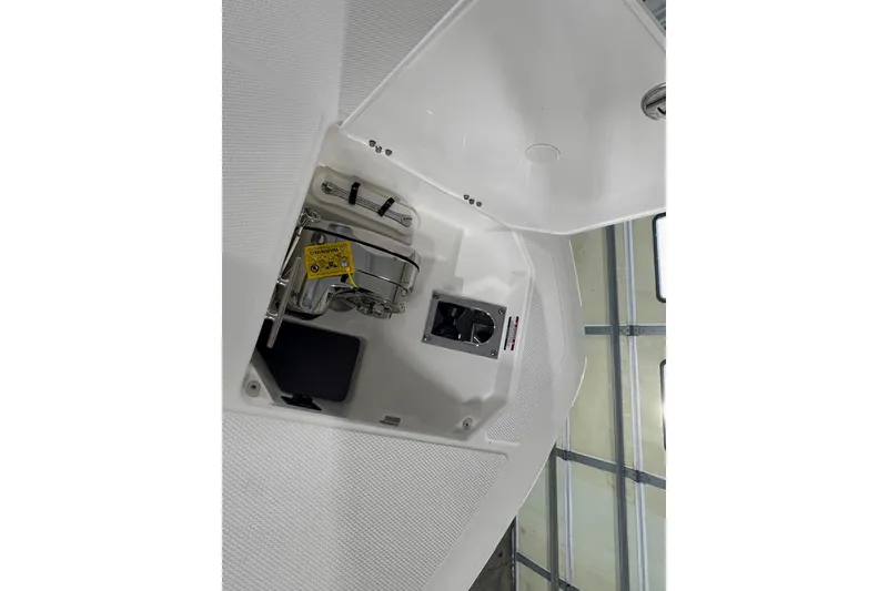 Slide: The Image of 2026 Robalo R300 Center Console interior detail, showcasing storage compartment and equipment. - 20