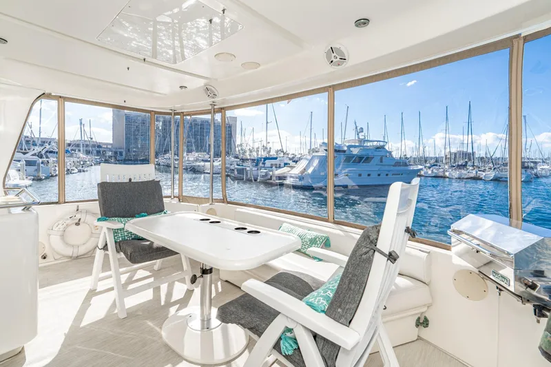 Slide: The Image of Interior of 1998 Sea Ray 420 Aft Cabin yacht with marina view. - 18