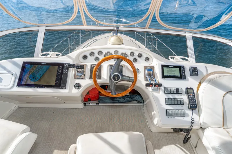 Slide: The Image of Cockpit of 1998 Sea Ray 420 Aft Cabin yacht with navigation equipment and steering wheel. - 24