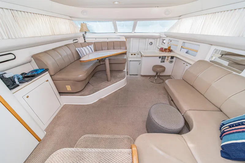 Slide: The Image of Luxurious interior of 1998 Sea Ray 420 Aft Cabin yacht with plush seating and elegant decor. - 29