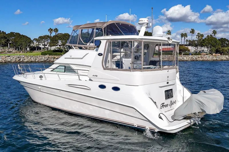 Slide: The Image of 1998 Sea Ray 420 Aft Cabin yacht cruising on a sunny day. - 3