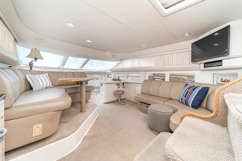 Slide: The Image of Luxurious interior of a 1998 Sea Ray 420 Aft Cabin yacht with plush seating and modern amenities. - 30