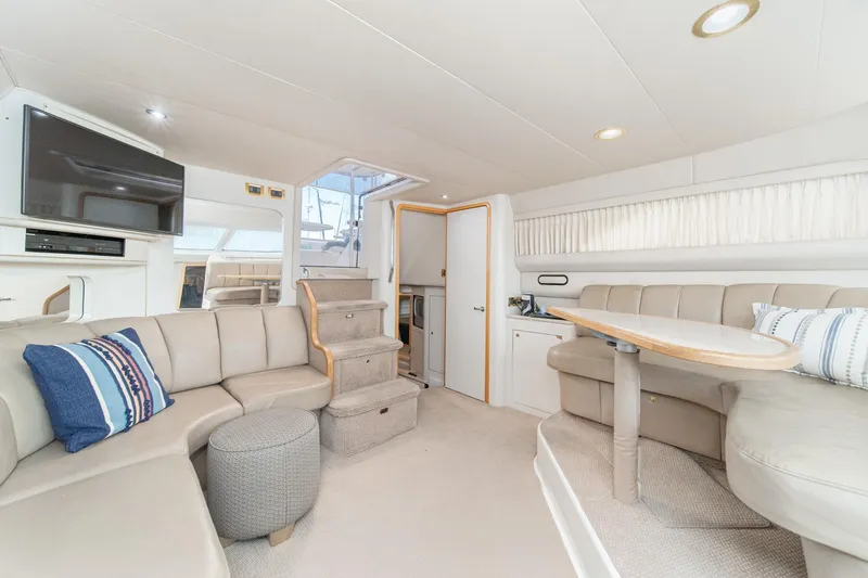 Slide: The Image of Luxurious interior of 1998 Sea Ray 420 Aft Cabin yacht with plush seating and modern amenities. - 32