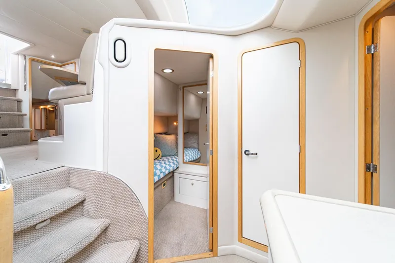 Slide: The Image of Interior of 1998 Sea Ray 420 Aft Cabin yacht, featuring cozy cabin and modern design. - 39