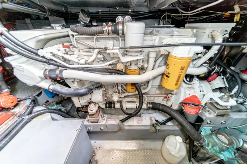 Slide: The Image of Engine room of a 1998 Sea Ray 420 Aft Cabin yacht, showcasing detailed machinery. - 50
