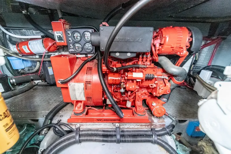 Slide: The Image of Engine room of 1998 Sea Ray 420 Aft Cabin with Westerbeke generator. - 51