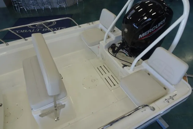 Slide: The Image of 2026 Boston Whaler 170 Montauk boat interior with Mercury engine and seating arrangement. - 10