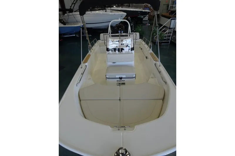 Slide: The Image of 2026 Boston Whaler 170 Montauk boat interior with seating and console. - 13