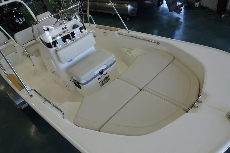 Slide: The Image of 2026 Boston Whaler 170 Montauk boat interior with seating and console. - 14
