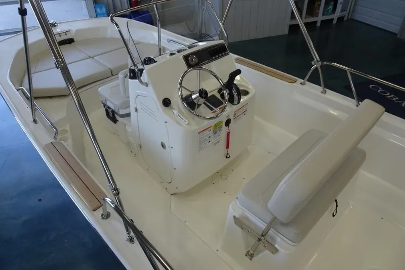 Slide: The Image of 2026 Boston Whaler 170 Montauk boat interior with steering console and seating. - 9