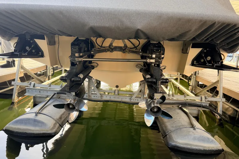 Slide: The Image of Rear view of a 2004 Cobalt 343 boat with dual propellers in a marina. - 15