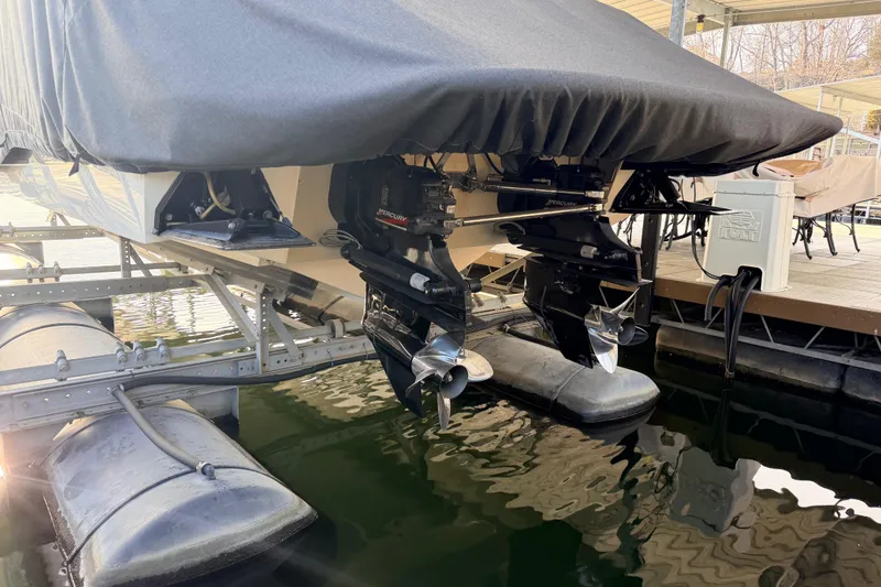Slide: The Image of 2004 Cobalt 343 boat with covered stern and dual Mercury outboard motors. - 16