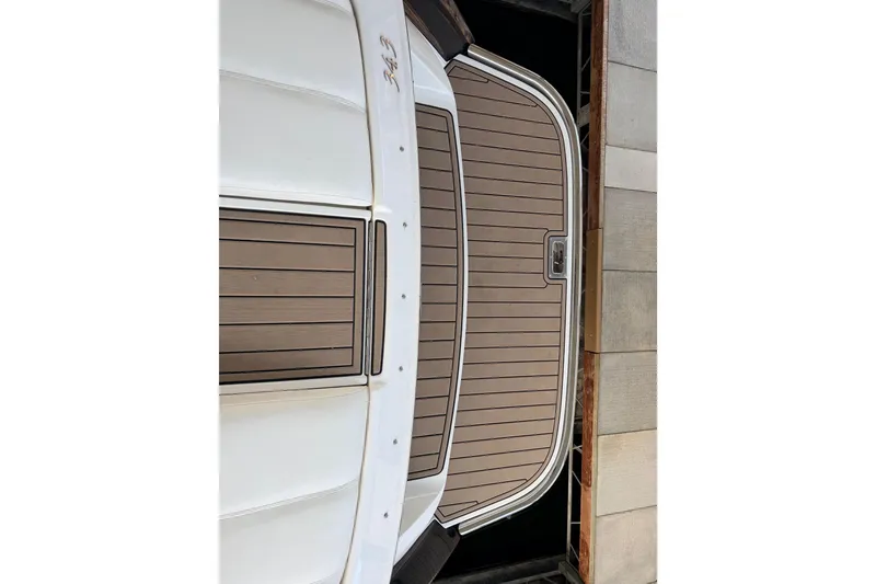 Slide: The Image of 2004 Cobalt 343 boat with teak swim platform and white hull. - 25
