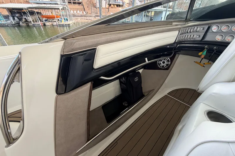 Slide: The Image of Interior of a 2004 Cobalt 343 boat, featuring dashboard and seating area. - 35
