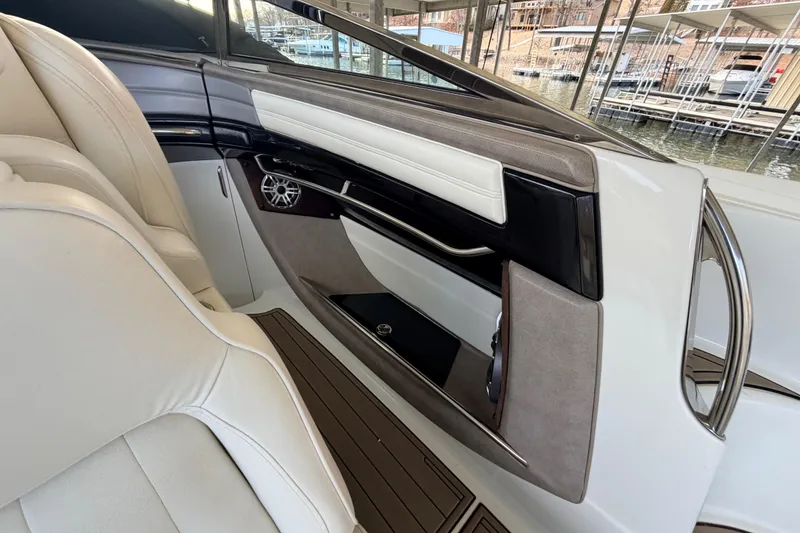 Slide: The Image of Interior of a 2004 Cobalt 343 boat, featuring luxurious seating and sleek design elements. - 36