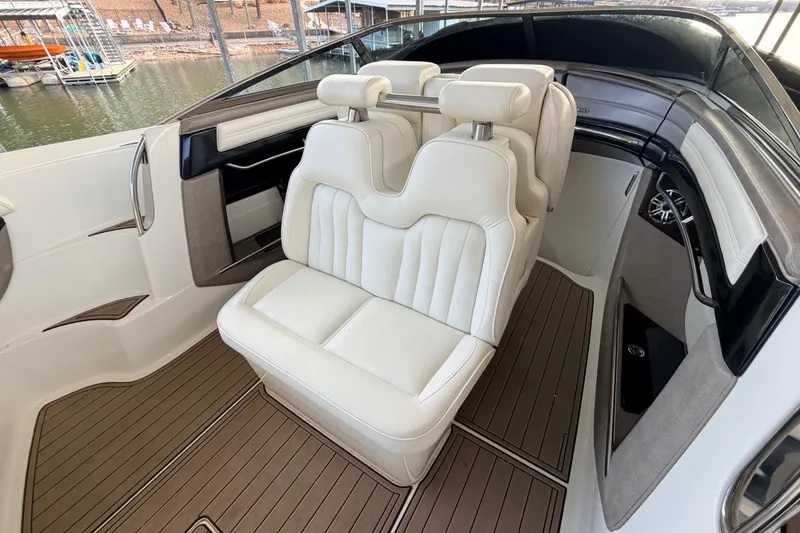 Slide: The Image of Luxury interior of 2004 Cobalt 343 boat with white leather seats and wood flooring. - 37