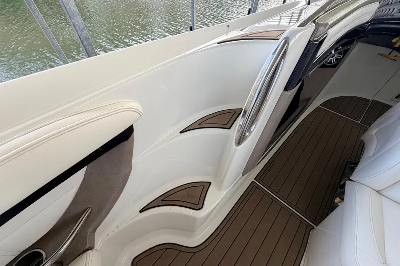 Slide: The Image of Interior of a 2004 Cobalt 343 boat with sleek white and brown design. - 40