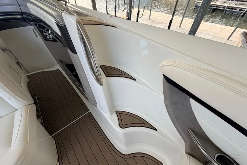 Slide: The Image of Interior of a 2004 Cobalt 343 boat with sleek white and wood accents. - 41
