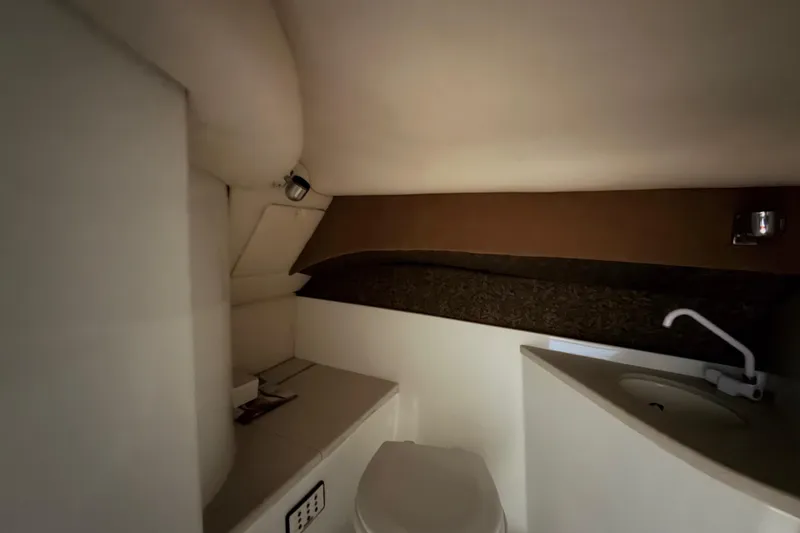 Slide: The Image of 2004 Cobalt 343 boat interior bathroom with sink and toilet. - 50