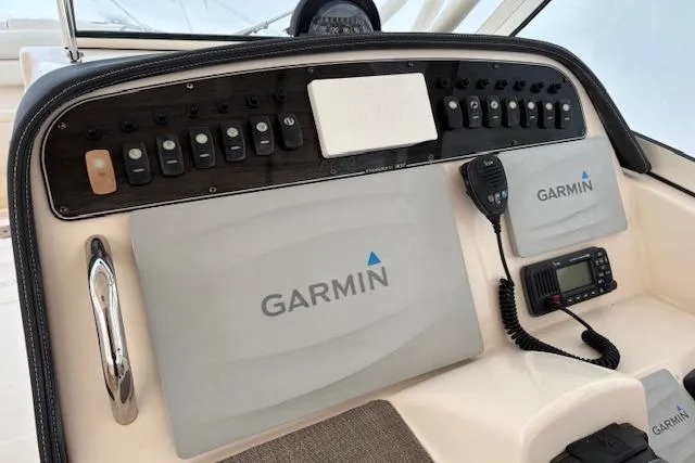 Slide: The Image of Control panel of 2017 Grady-White Freedom 307 boat with Garmin navigation system. - 11