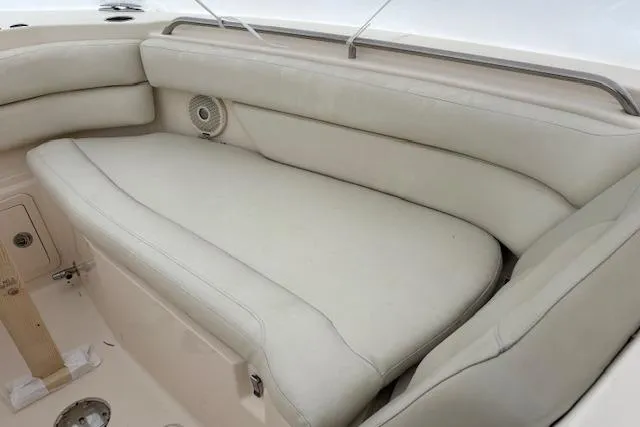 Slide: The Image of 2017 Grady-White Freedom 307 boat interior with cushioned seating and speaker. - 12