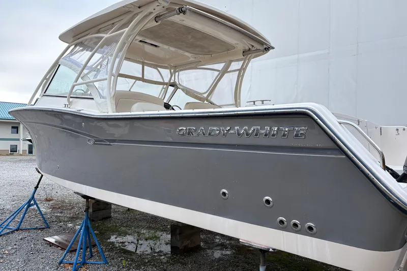 Slide: The Image of 2017 Grady-White Freedom 307 boat on stands, side view. - 3