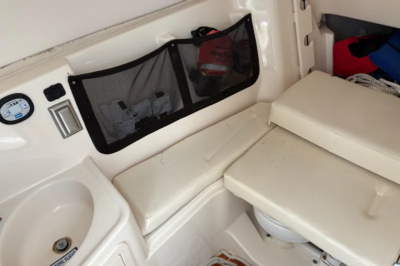Slide: The Image of 2017 Grady-White Freedom 307 boat interior with seating and storage compartments. - 7