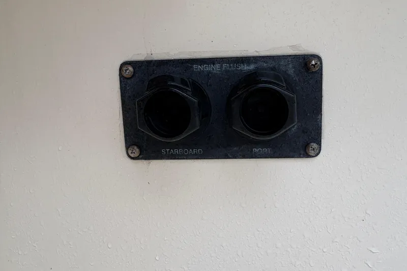 Slide: The Image of Engine flush ports on 2017 Grady-White Freedom 307 boat, labeled starboard and port. - 9