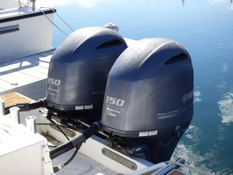 Slide: The Image of Twin Yamaha outboard motors on a 2016 Sea Fox 256 Voyager boat. - 13