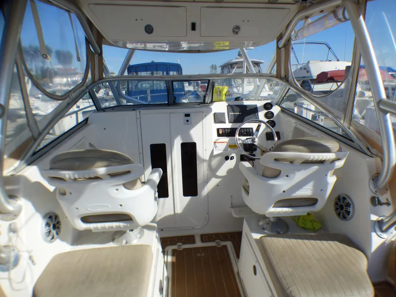Slide: The Image of Interior view of 2016 Sea Fox 256 Voyager boat with dual seats and steering console. - 14