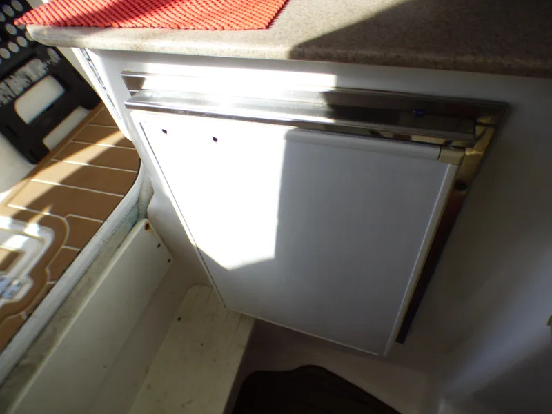 Slide: The Image of 2016 Sea Fox 256 Voyager interior with built-in storage compartment. - 23