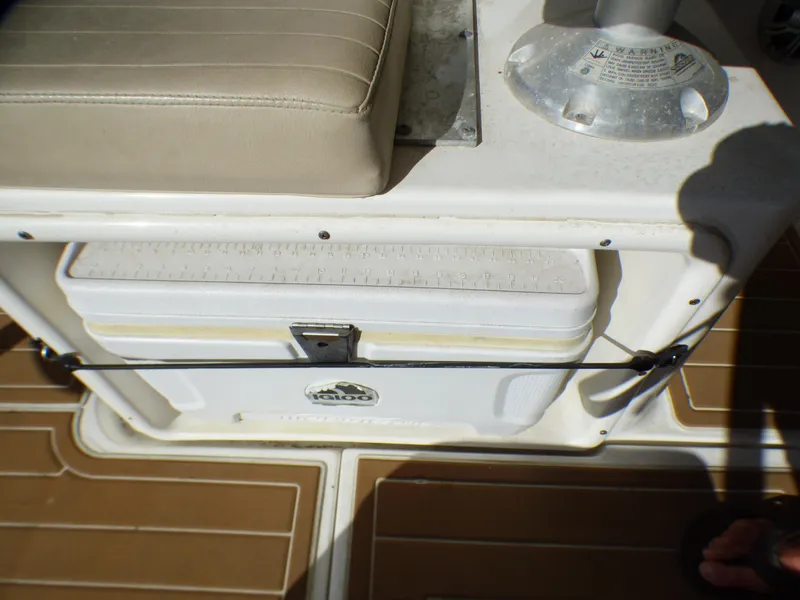 Slide: The Image of 2016 Sea Fox 256 Voyager boat interior with cooler and seating area. - 31