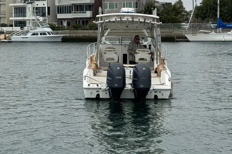Slide: The Image of 2016 Sea Fox 256 Voyager boat with dual engines on calm water. - 8