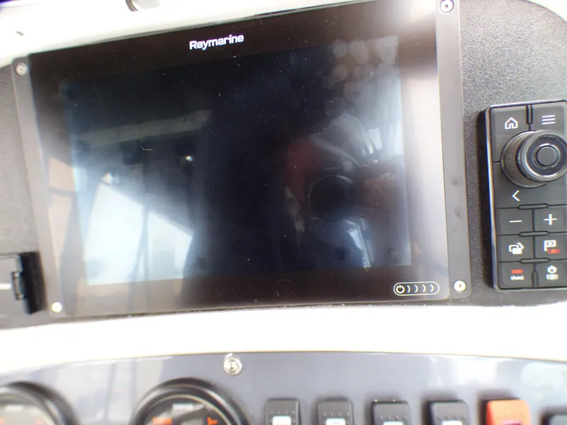 Slide: The Image of Raymarine display on 2004 Robalo R265 Walkaround boat dashboard. - 31