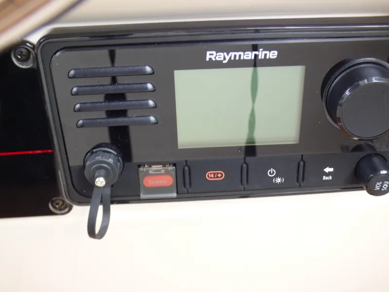 Slide: The Image of Raymarine marine radio on 2004 Robalo R265 Walkaround boat dashboard. - 36