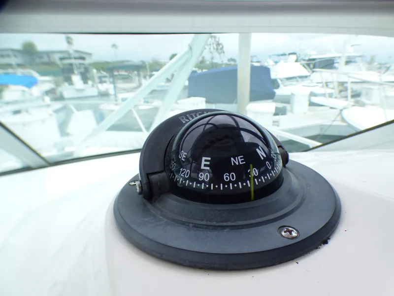Slide: The Image of Compass on 2004 Robalo R265 Walkaround boat, docked at marina. - 38