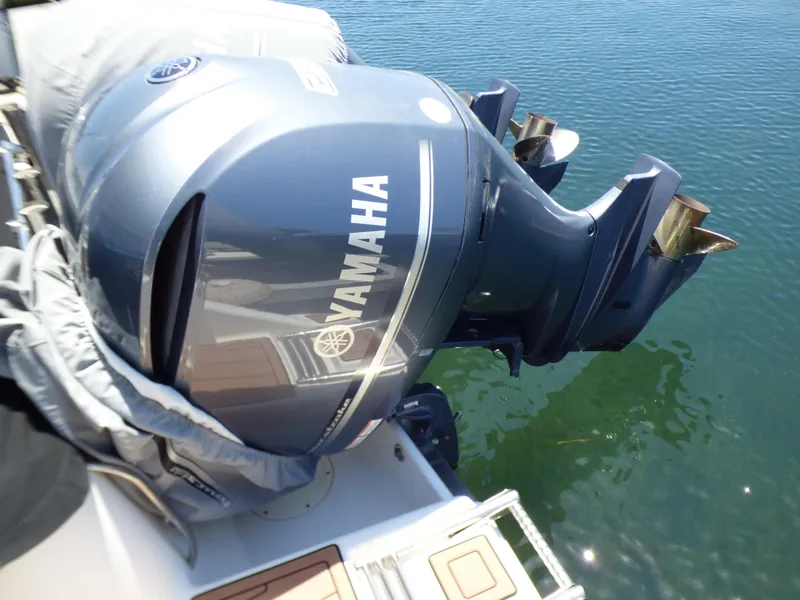 Slide: The Image of 2004 Robalo R265 Walkaround with Yamaha outboard motor on water. - 42