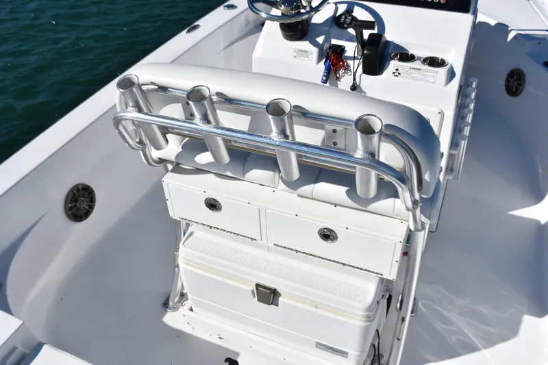 Slide: The Image of 2015 Sportsman Masters 227 Bay Boat interior with rod holders and storage compartments. - 15